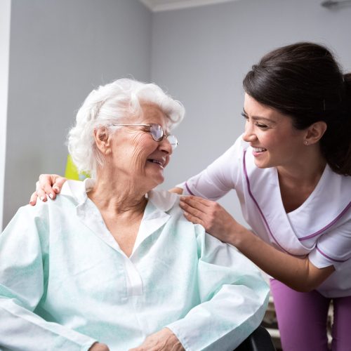 Satisfied and happy senior woman patient with nurse Satisfied and happy senior woman patient with nurse